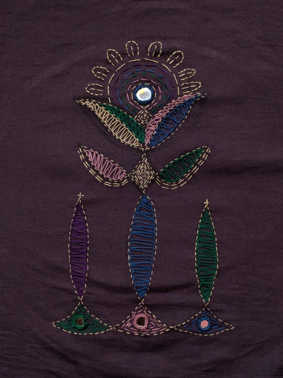 Hand embroidered flora motif on aubergine cotton