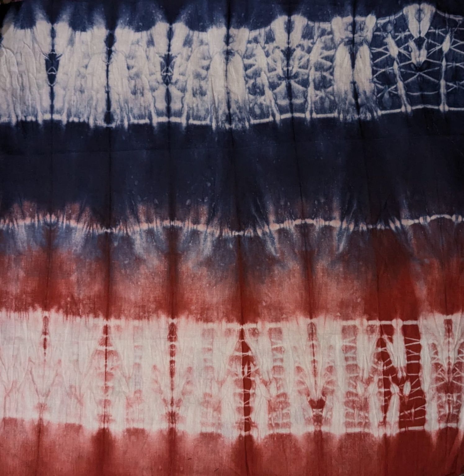 Banded shibori in indigo, rust and cream